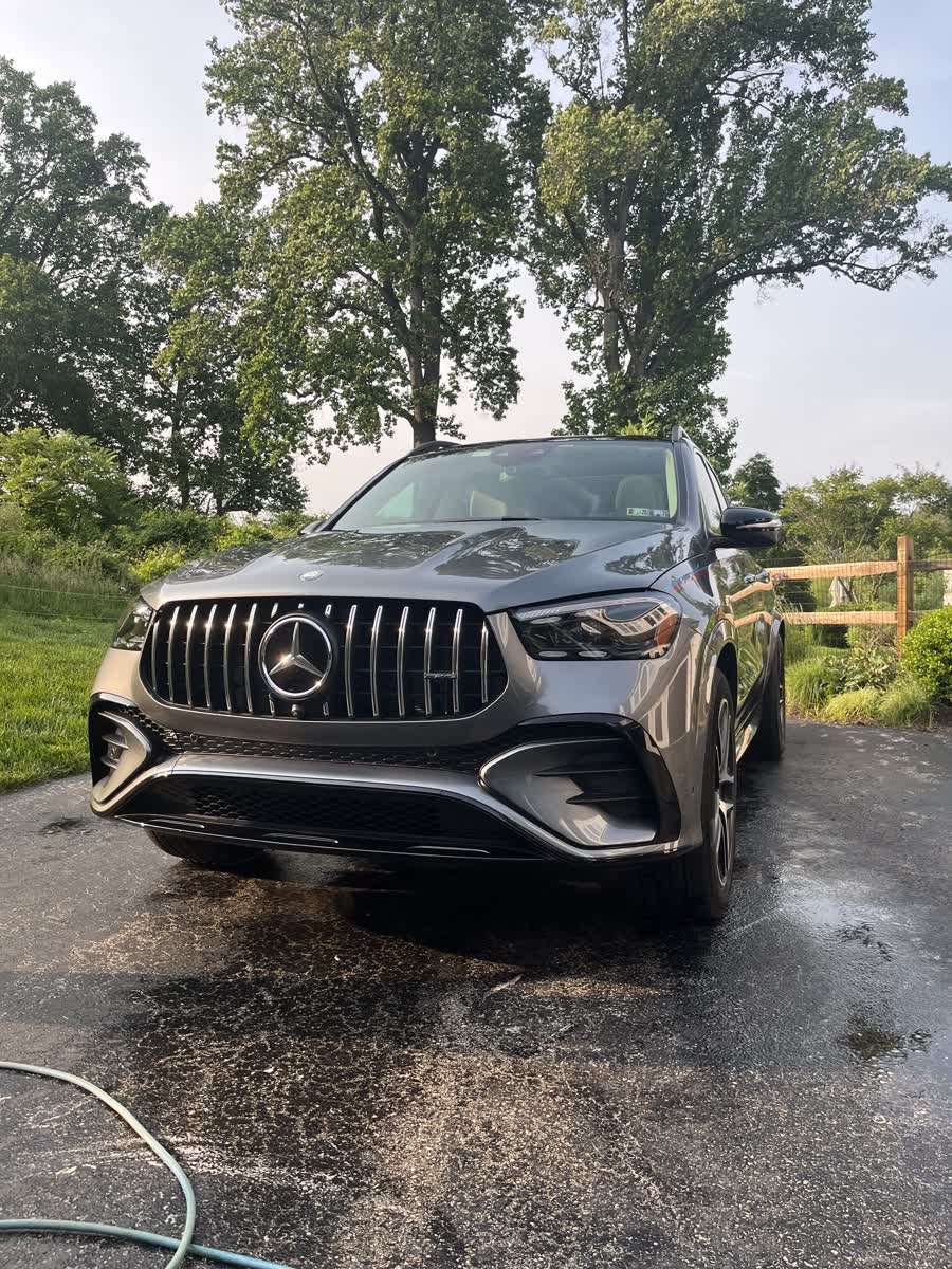 Mercedes-AMG SUV part way through a wash on a client driveway